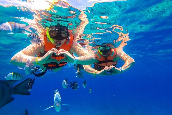 Cozumel Catamaran Tour: Snorkel at Top Reefs & Open Bar - The open bar, music, and the mood onboard