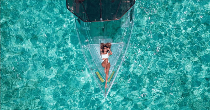 Explore the sea of cozumel in a transprent boat with drinks and snorkel. - A Clear View of Cozumel’s Underwater World
