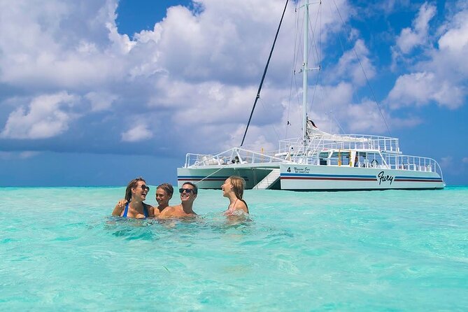 Luxury Cozumel Catamaran: Snorkel, Beach Club & Relaxation - Snorkeling from the 65-foot catamaran