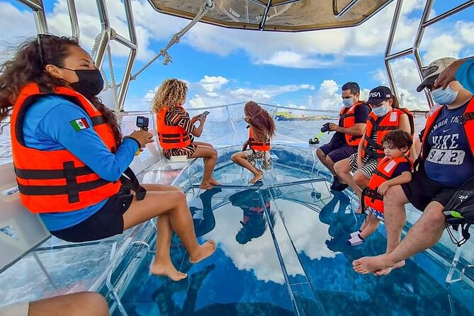 Transparent Boating and Snorkeling Tour in Cozumel All Inclusive - A clear boat over Cozumel’s turquoise water